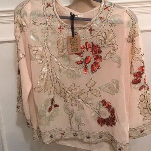 Cream lightly beaded top